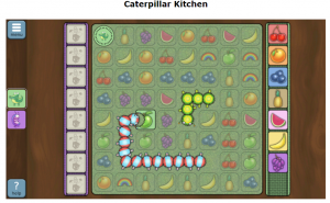 Kuva pelilaudasta missä kaksi matoa syö hedelmiä.