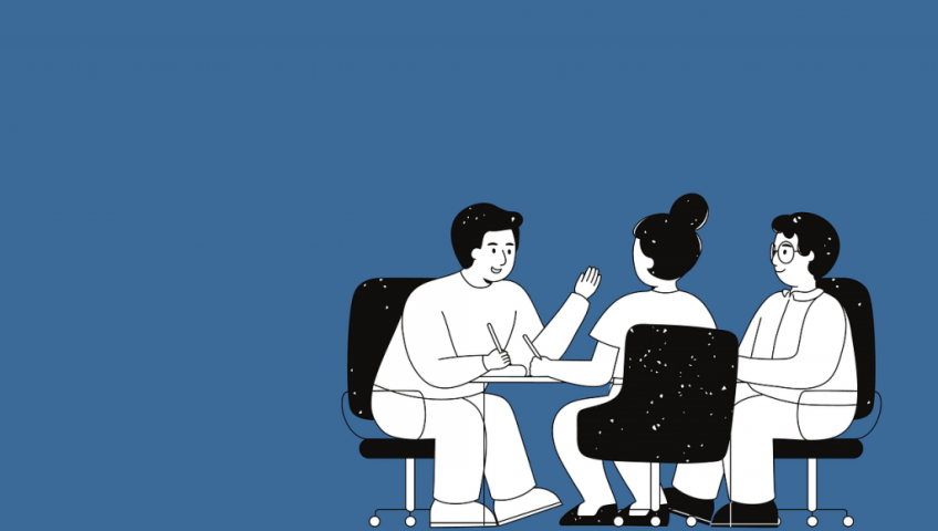 aikuiset istuvat pöydän ääressä